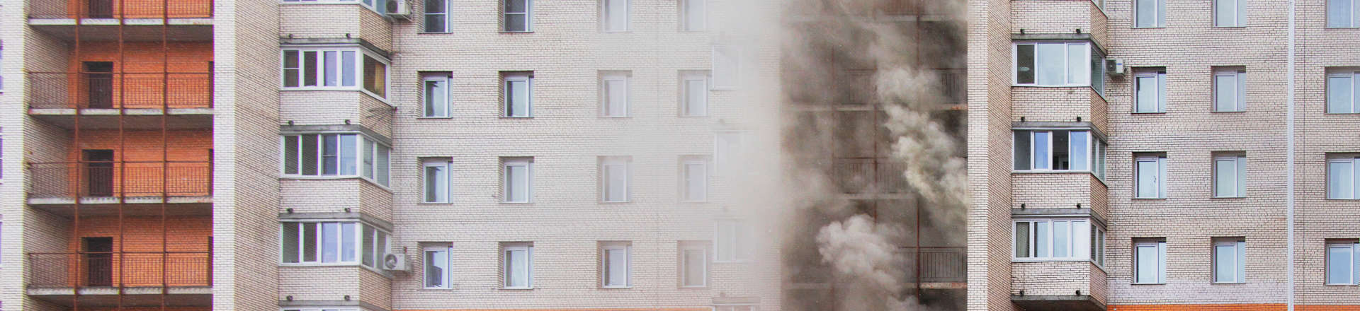 smoke coming out of an apartment building